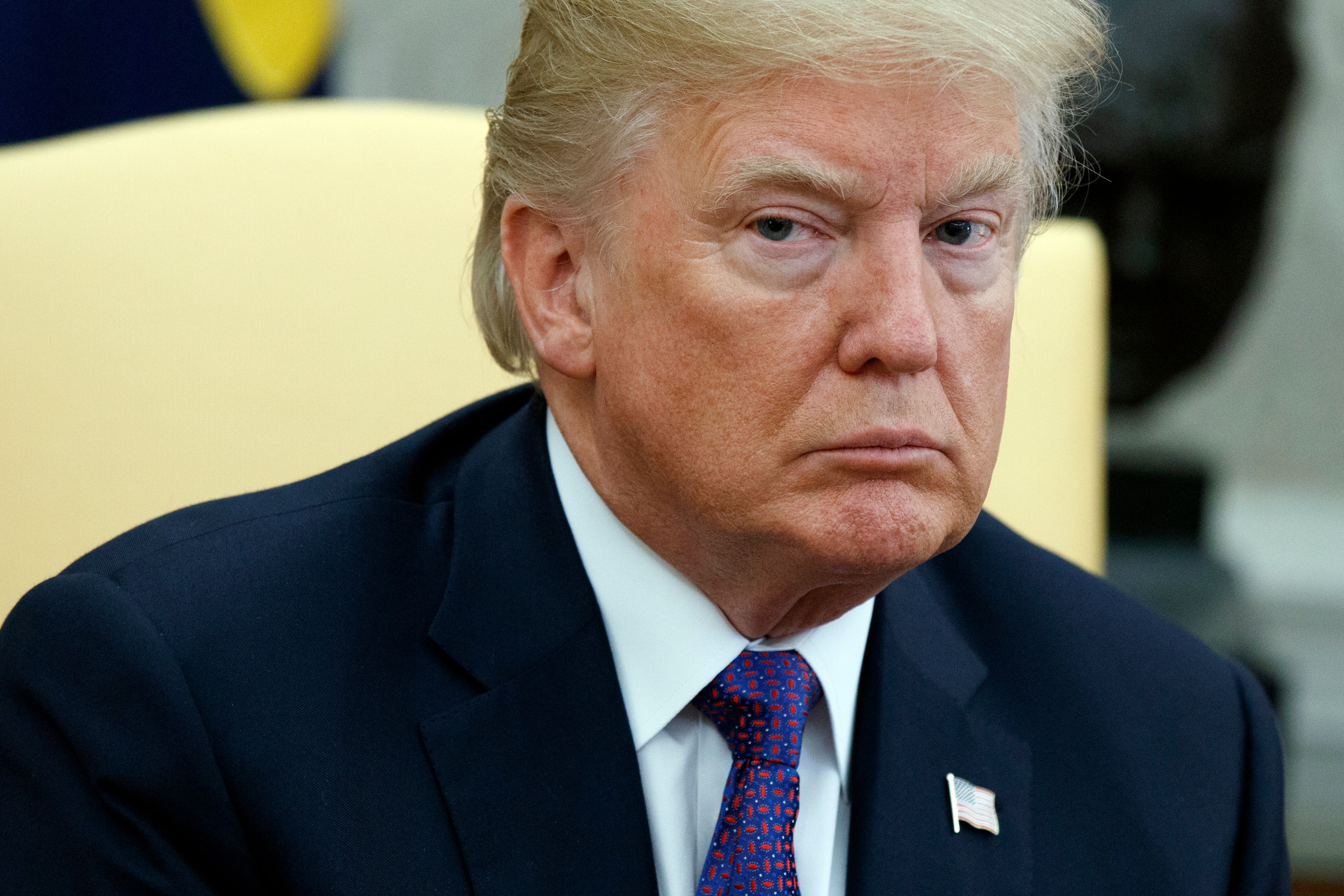 'I'm not a racist,' Trump declares; his Palm Beach weekend ends today